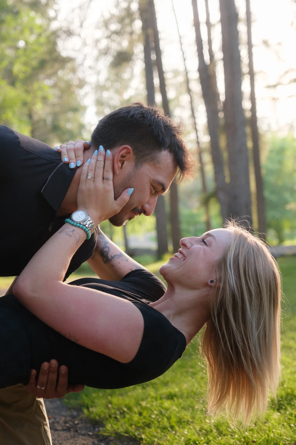A couple holding each other in a dip and looking into each other’s eyes.