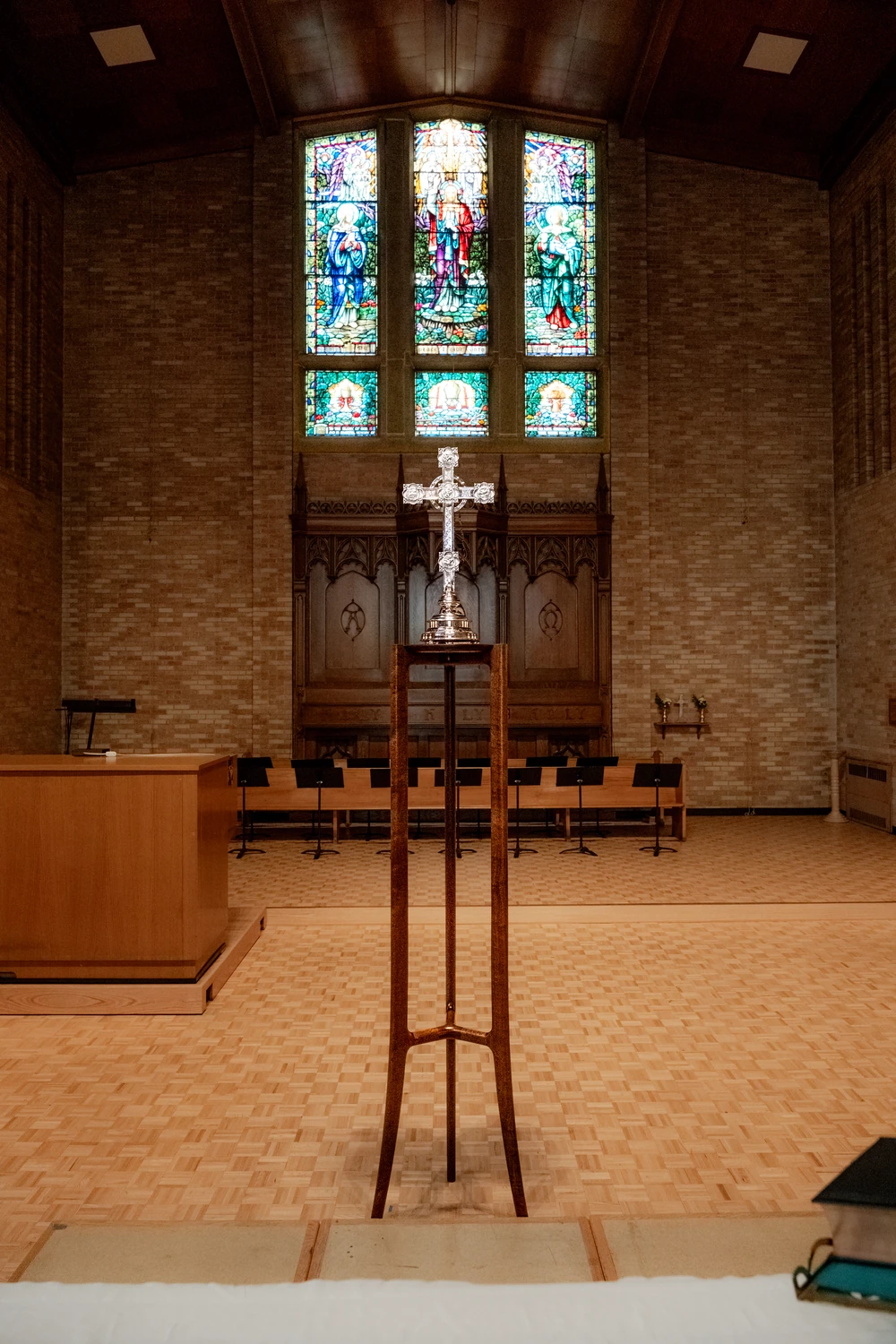 A finished wooden stand centred in a church interior.